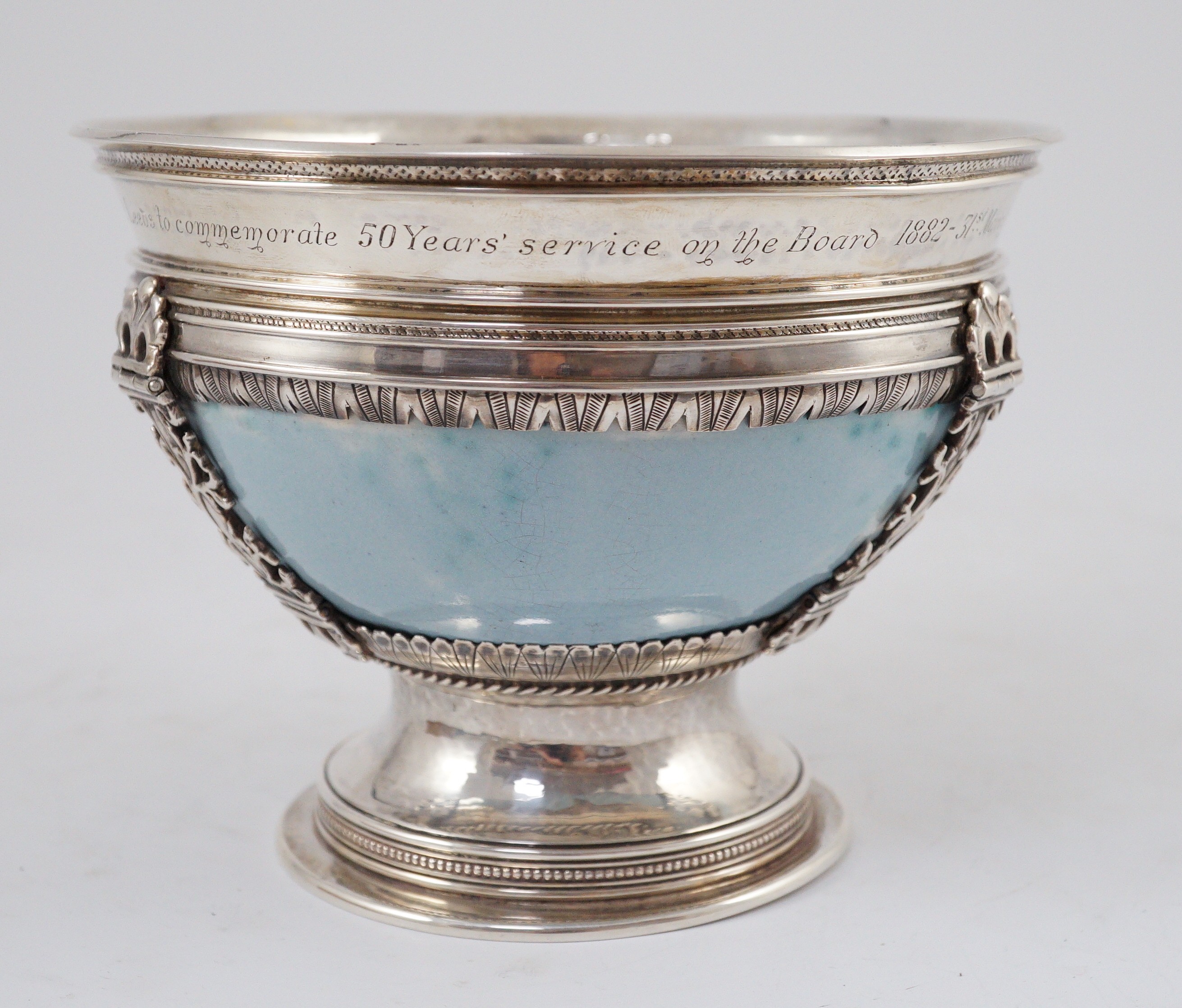 An Arts and Crafts silver mounted Ruskin pottery pedestal bowl, the silver mounts by A.E. Jones, Birmingham 1929, 16.5cm diameter